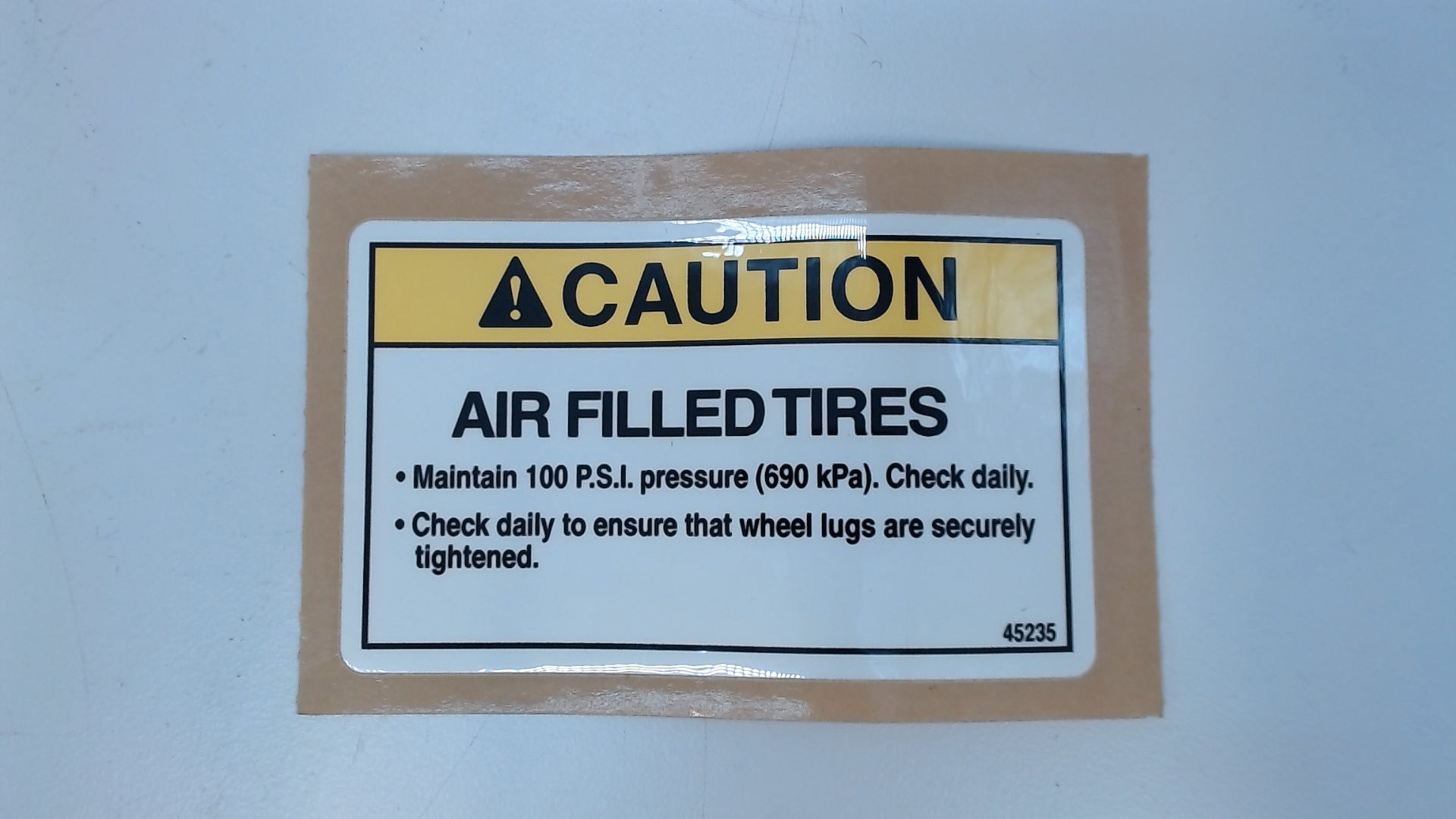 DECAL, CAUTION, AIR FILLED TIRE